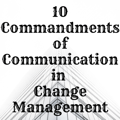 Writing stating 10 Commandments in Change Management behind a skyscraper